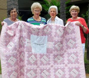Breast Cancer Quilt. Shown are Frances Tyler, Christine Carmichael, Fay Sloan, and Jan Austin.