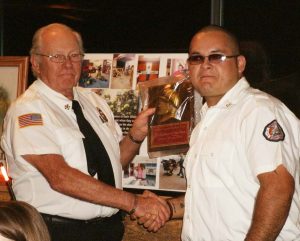 DILLON COUNTY STATION NINE (OAK GROVE) FIRE DEPARTMENT FIREFIGHTER OF THE YEAR - Chief Terry Weichel presented the Firefighter of the Year award for 2016 to Josh Caulder. (Photo by Betsy Finklea/The Dillon Herald) 