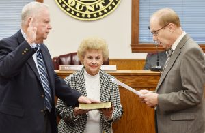 PAUL GASQUE administers the oath of office to District Four Councilman T.F. “Buzzy” Finklea, Jr., who was re-elected. Pictured  holding the Bible is his wife, Nancy G. Finklea.  (Photo by Johnnie Daniels/The Dillon Herald)