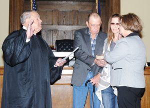  DILLON COUNTY CLERK OF COURT Gwen T. Hyatt took the oath of office for another term. The oath was administered by Judge James E. Lockemy. Pictured with her holding the Bible are her husband, Don, and daughter, Nicki. (Photo by Johnnie Daniels/The Dillon Herald)