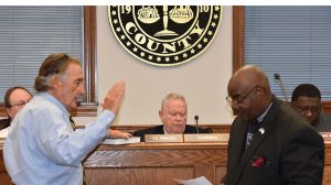 BISHOP EUGENE CAMPBELL administers the oath of office to District Two Councilman Jack Scott, who was elected to his first term in office. (Photo by Johnnie Daniels/The Dillon Herald)