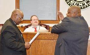 BISHOP EUGENE CAMPBELL administers the oath of office to District One Councilman James Campbell, who was elected to his first term in office. (Photo by Johnnie Daniels/The Dillon Herald)