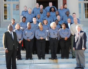 THE DILLON COUNTY DETENTION CENTER OFFICERS—Pictured in front are Chief Deputy Larry Abraham and Sheriff Major Hulon. On the first row is (l-r) Jimmie Faye Townsend, Lateau Greer, Robin Douglas, Peggy Barfield, Pamela Johnson. On the second row is Deloris Smith, Sarah Samuel, Kenneth Black, Linda Hyatt, Adrienne Scott, Chaplain Haywood Proctor, and Roderick Miller. On the third row is Walter Dudley, Terry McArthur, Larry Evans, Johnny Brown, and Jerry Lewis. On the fourth row is Tommy Hulon, James Samuel, and Latasha Day. On the last row is Chad Dickerson, Richard Best, Chris Caulford, John Goodwin, Jerry Hewitt, and Wendy Causey. (Photo by Johnnie Daniels/The Dillon Herald)