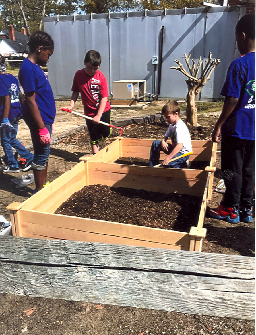 East Elementary students working on their garden.